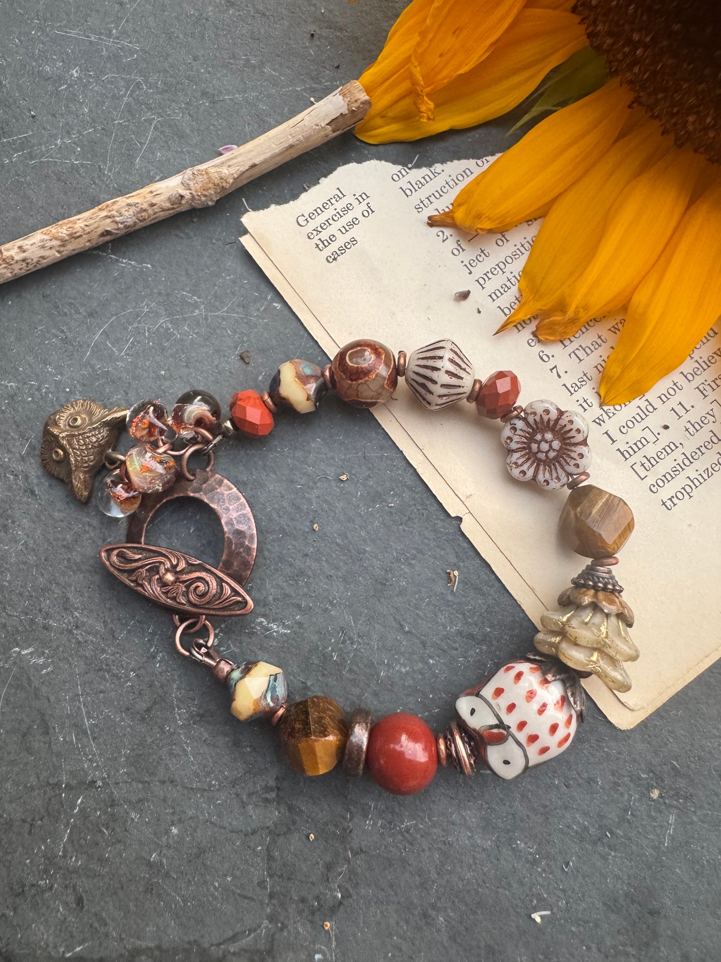Tiger eye, jasper, agate, czech glass, lampwork glass, ceramic, copper metal. Owl theme.