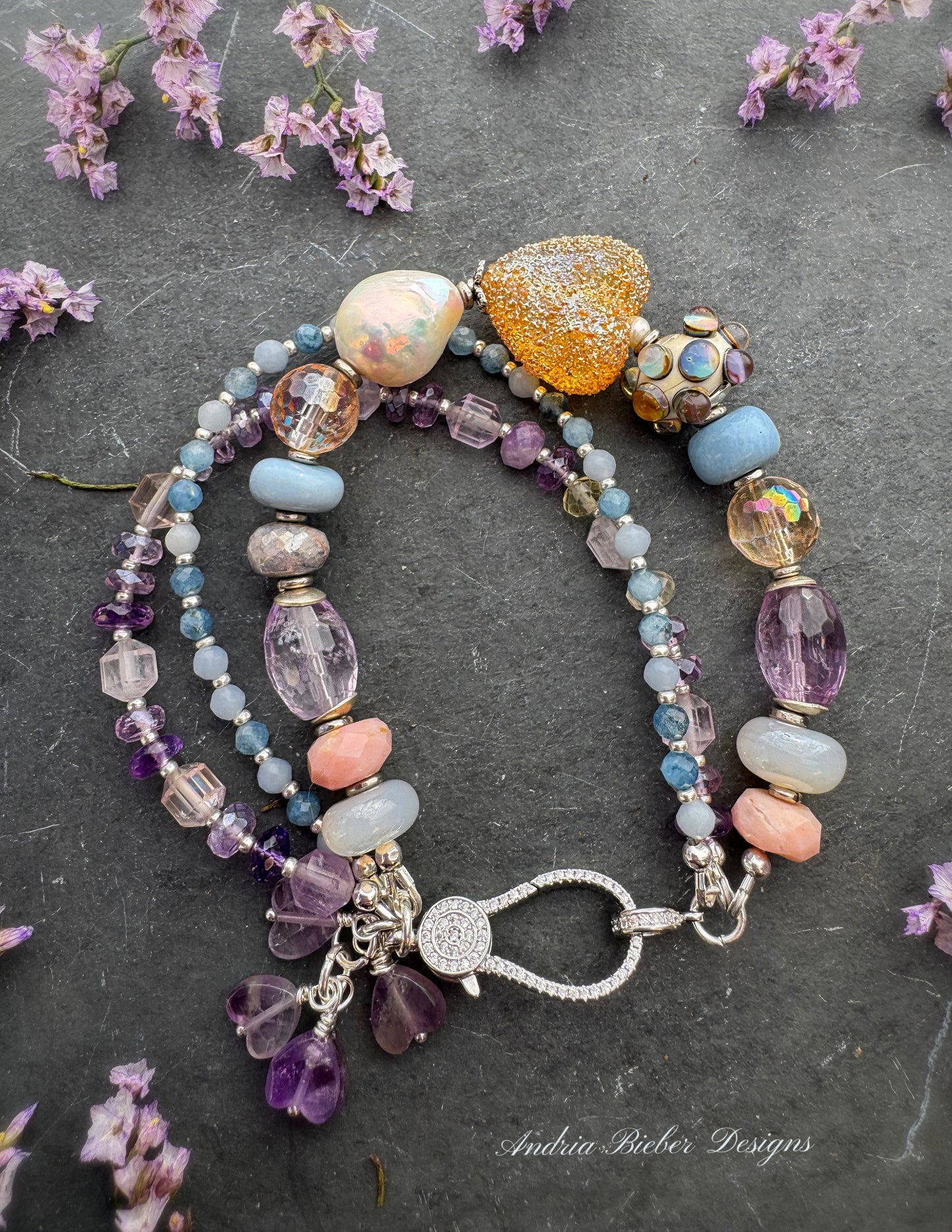 handmade lampwork glass, baroque pearl, blue opal, citrine with AB, moonstone, labradorite, pink opal, amethyst, and kyanite. Rhinestone clasp. Bracelet.
