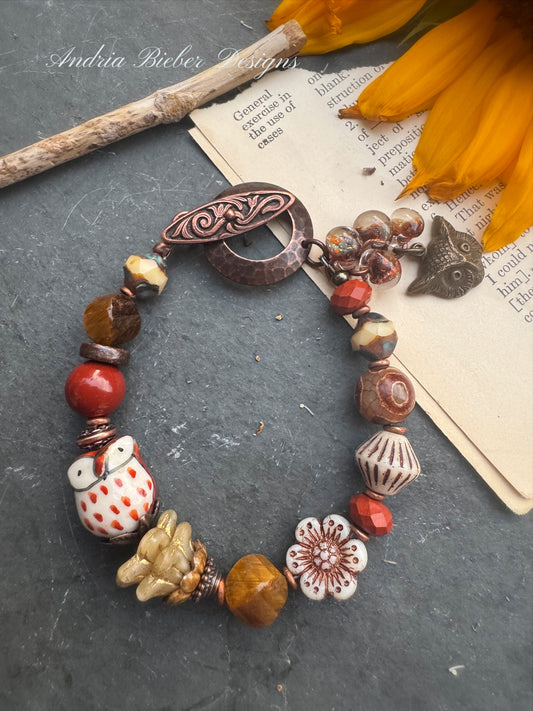 Tiger eye, jasper, agate, czech glass, lampwork glass, ceramic, copper metal. Owl theme.