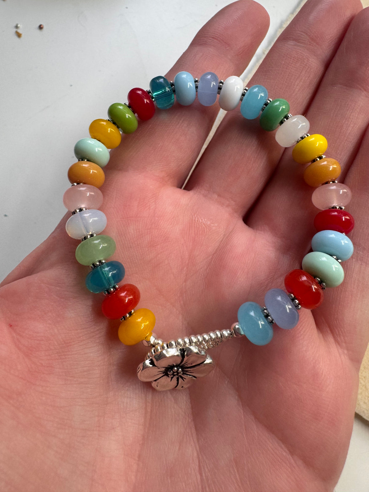 Multi glass, button, silver metal, bracelet.