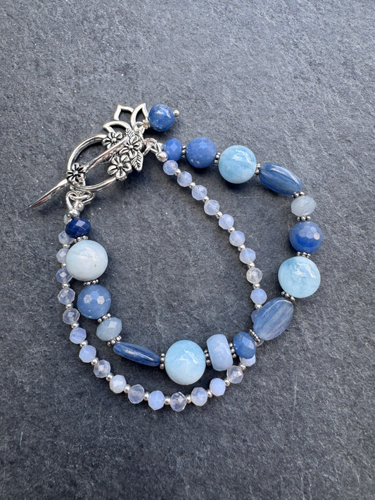 Kyanite and aquamarine gemstone and silver metal bracelet.