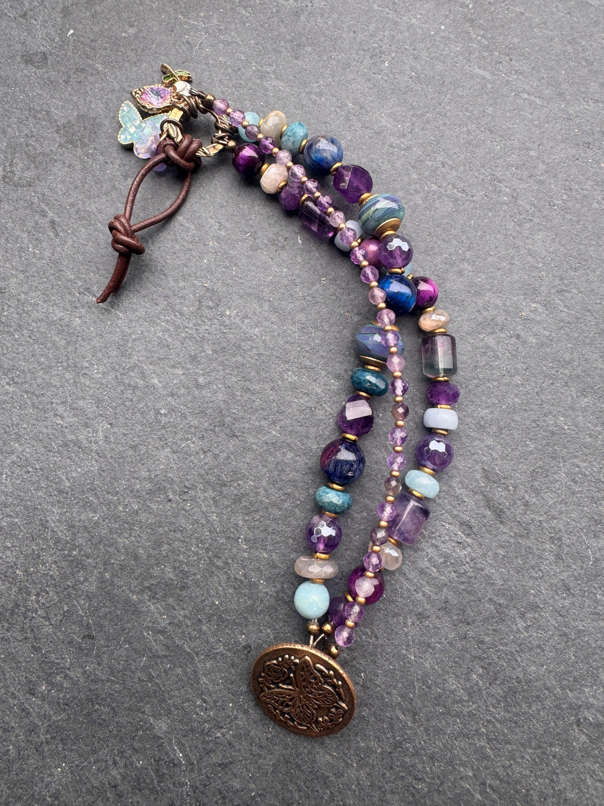 handmade lampwork glass, labradorite, fluorite, tigers eye, amethyst, aquamarine, moonstone, apatite, and  handmade butterfly button clasp.
