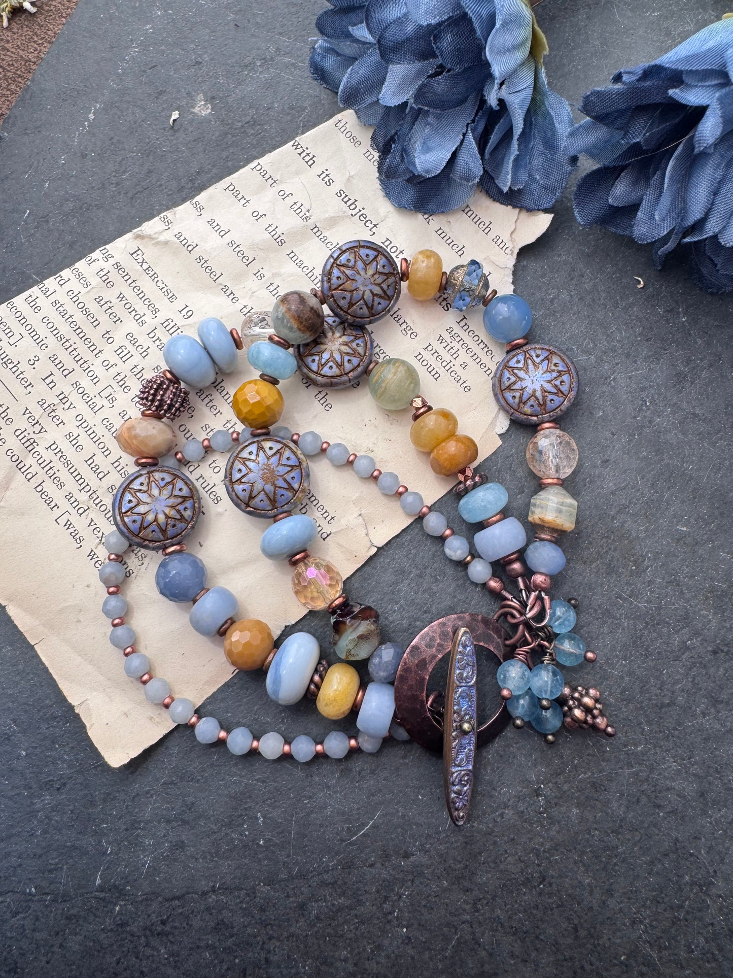 Blue opal, yellow jasper, Czech glass, citrine, agate, blue aventurine, Aquatine Lemurian Blue Calcite and copper metal.