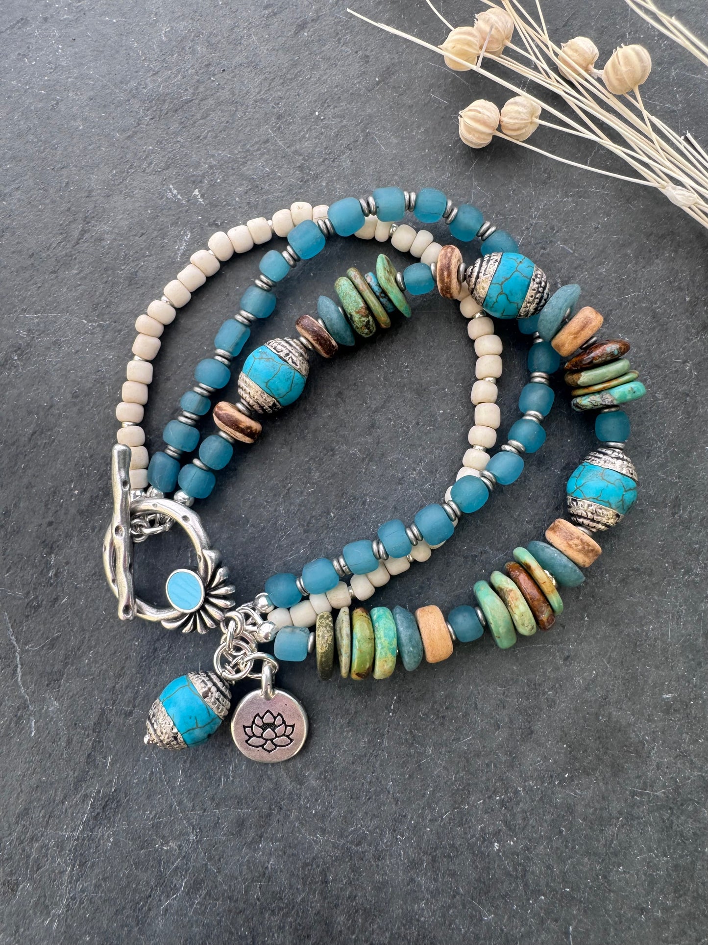 Turquoise, wood, Java glass, silver metal, bracelet.