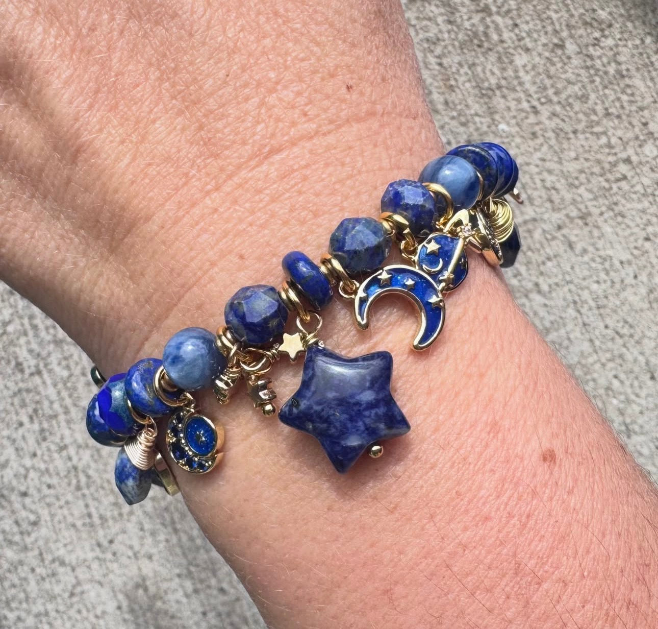 Space charm bracelet. Lapis lazuli, sodalite, charms and gold metal bracelet.