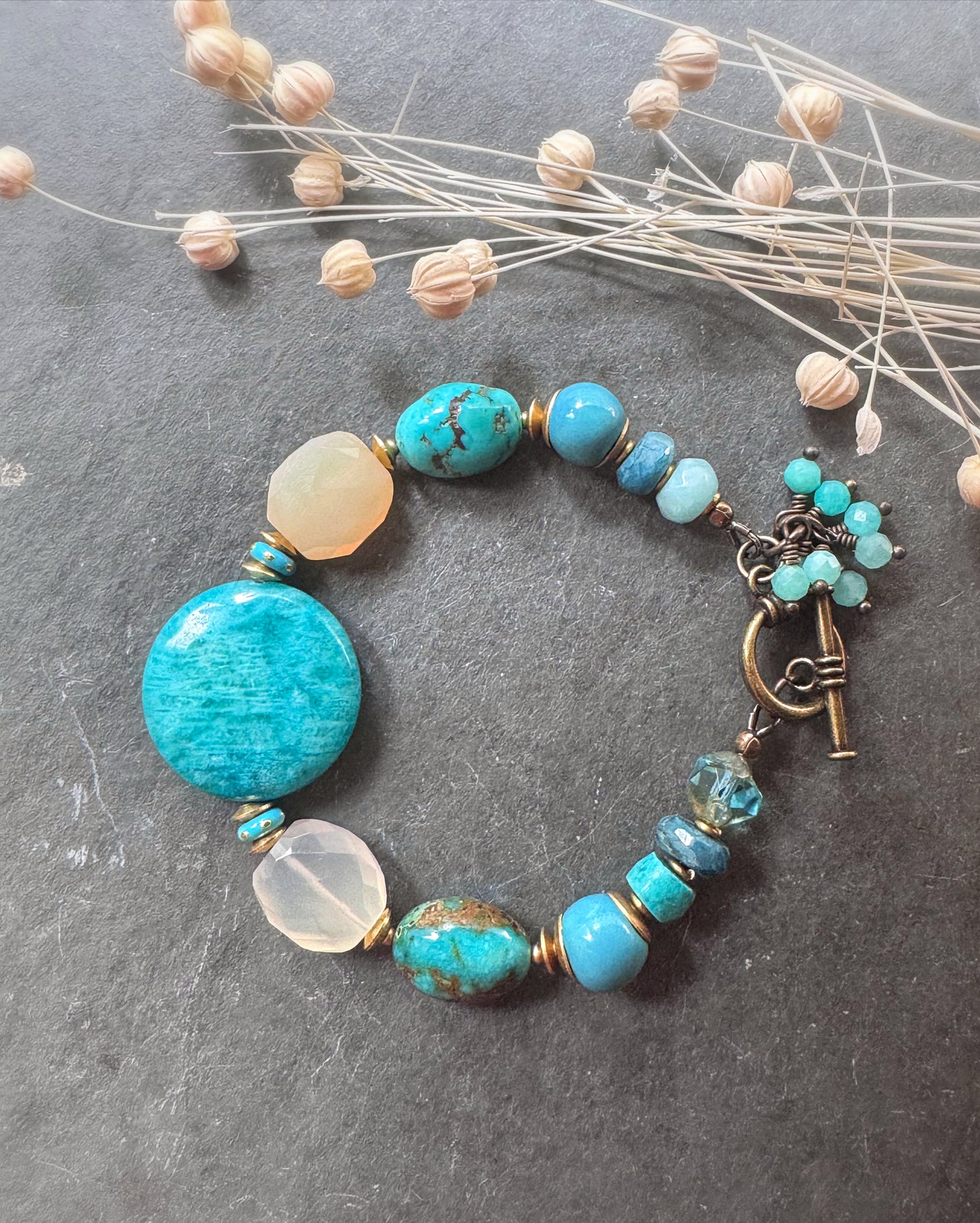 Turquoise, chalcedony, ceramic rounds, apatite stone and African brass bracelet.