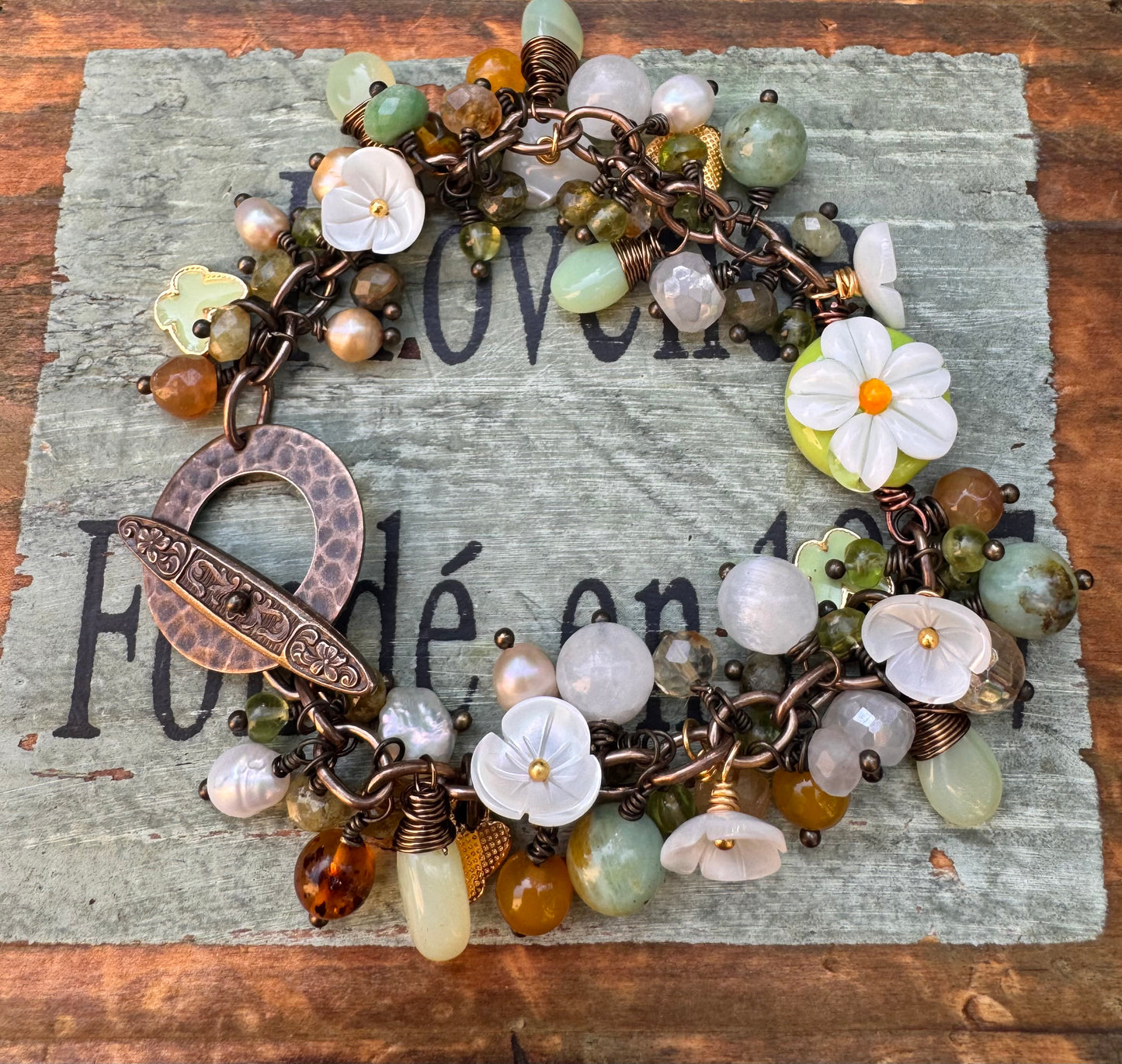 Daisy. Handmade lampwork glass, Mixed gemstone, pearls, bronze metal, charm bracelet.