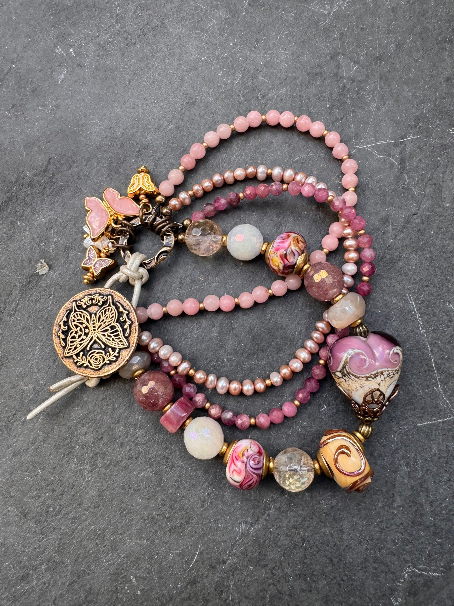 Pink opal, pink Tourmaline, moonstone mystic, strawberry quartz mystic, citrine mystic, pink pearls and handmade lamp work glass, bronze butterfly button, white leather.