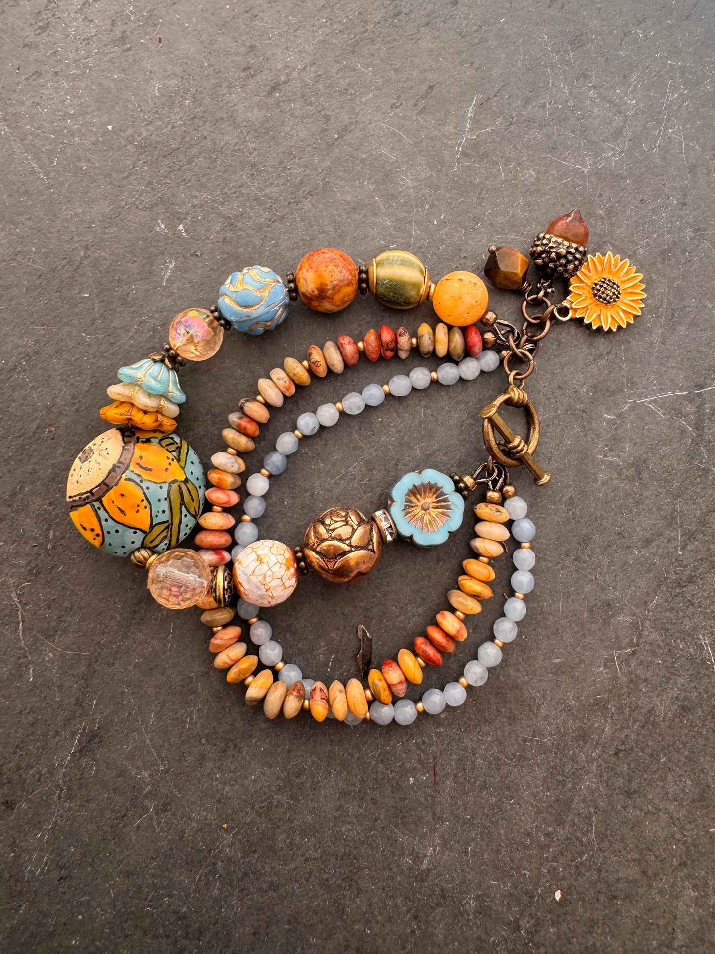 Blue sky Sunflower. 🌻ceramic beads, Handmade lampwork glass, citron, crazy lace, aquamarine, Czech glass, bronze metal, bracelet.