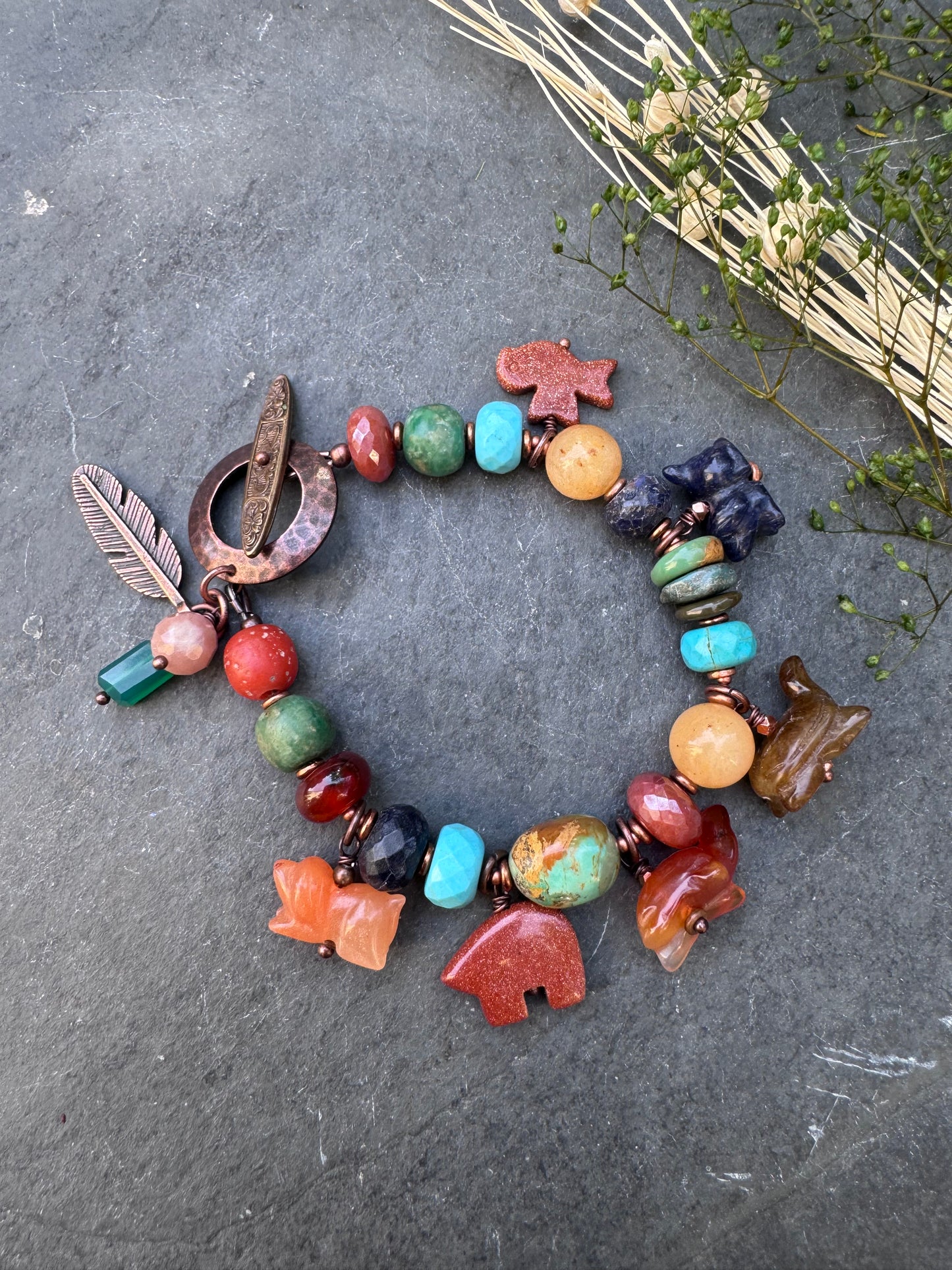 Turquoise, lapis, carnelian agate, sunstone, mixed stone, copper bracelet. Animal stone charms.