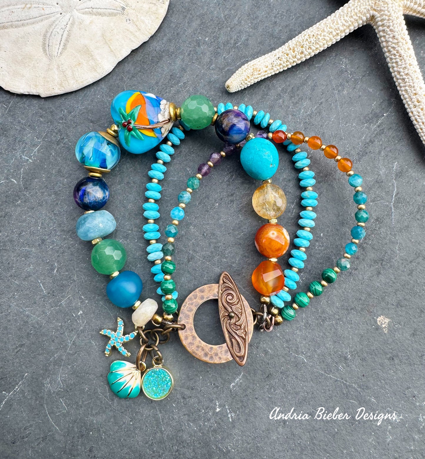 Beach. Mixed gemstone, lampwork glass, bronze metal.