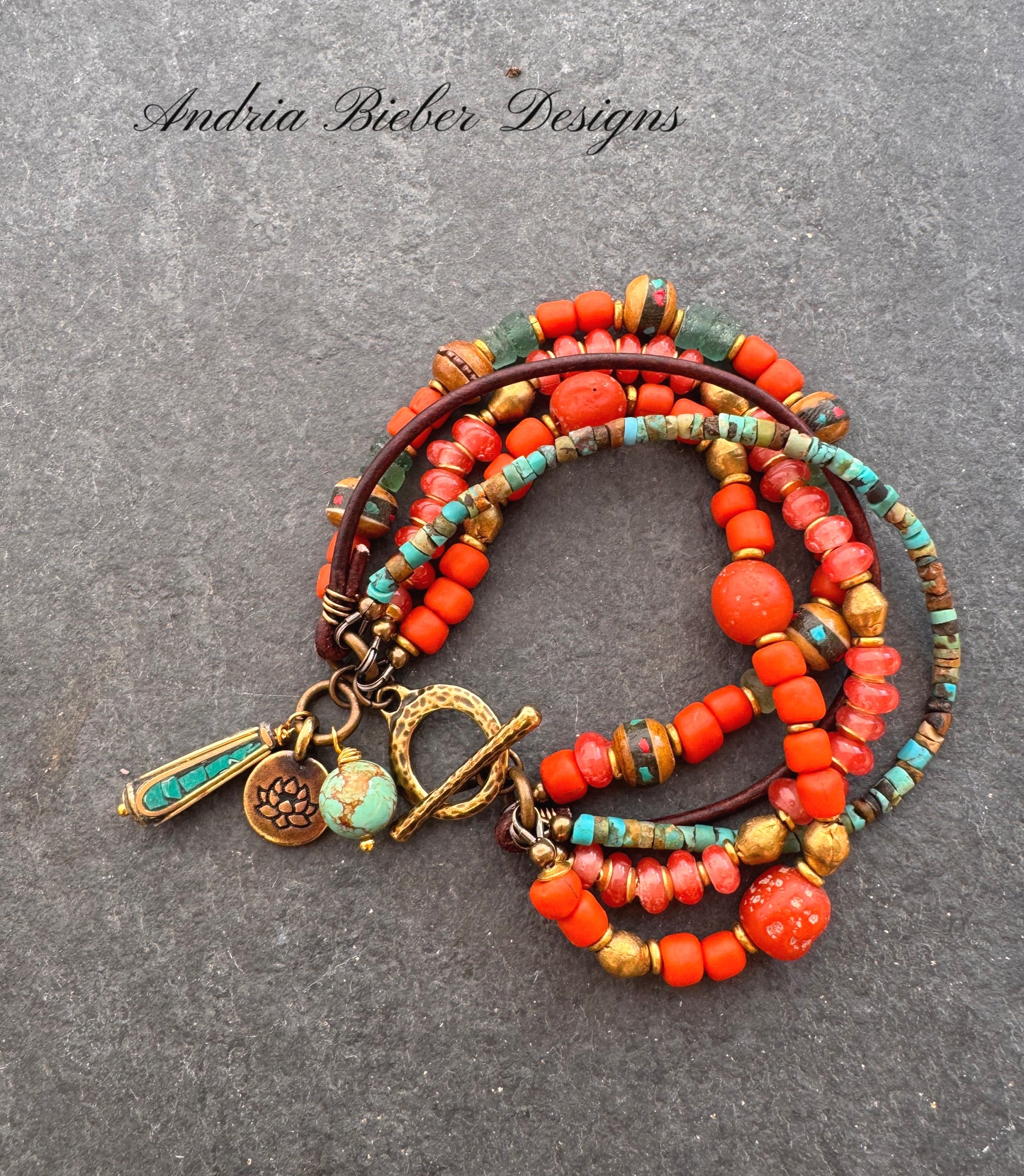 Turquoise, leather, African glass, wood, agate, brass metal bracelet.