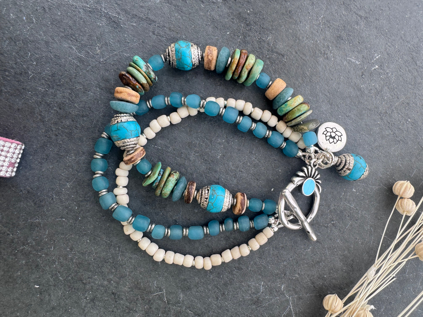 Turquoise, wood, Java glass, silver metal, bracelet.