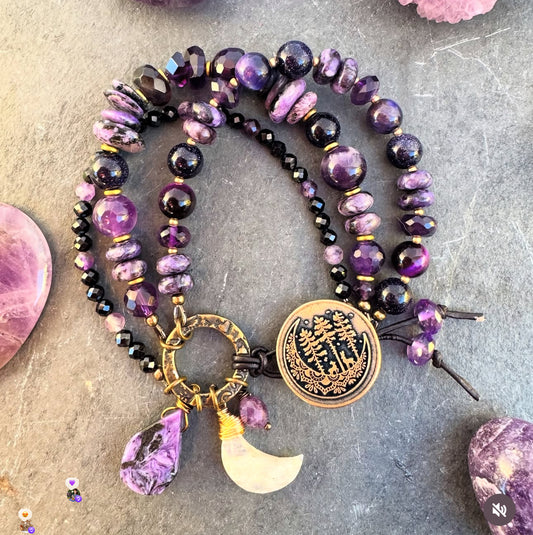 amethyst, Onyx, purple goldstone, Charoite and purple tigers eye. Button detailed clasp.