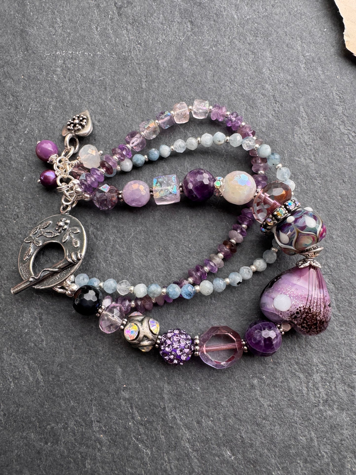 Cosmic layers. Aquamarine, Handmade lampwork glass, rhinestones, moonstone, amethyst, silver metal, flower clasp, bracelet