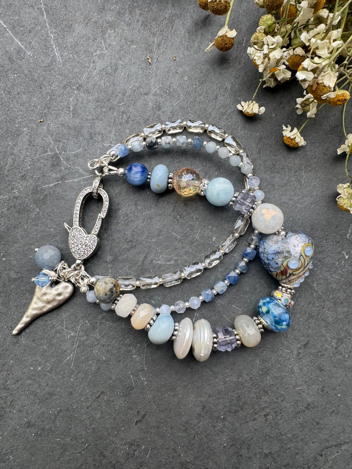 Lamp work glass, blue opal, blue kyanite, mystic moonstone, mystic citrine, pearls, iolite, aquamarine, crazy lace blue agate, blue aventurine stone, silver metal, rhinestone clasp, bracelet