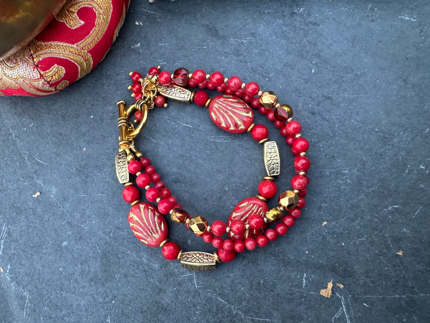 Red Czech glass, red coral, gold metal, bracelet