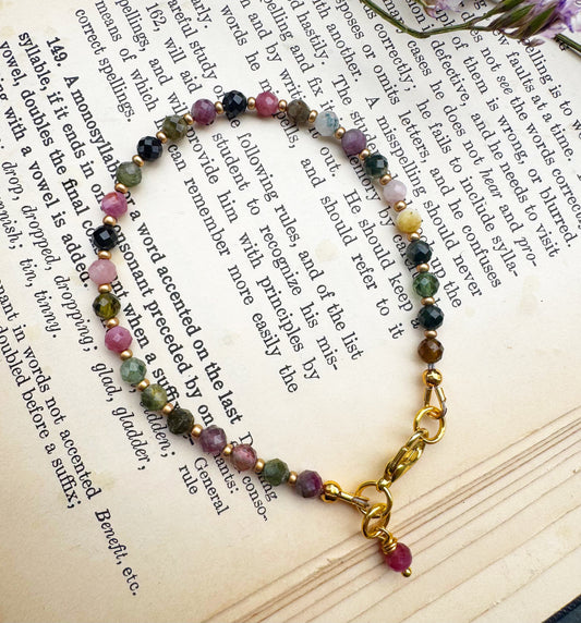 Watermelon tourmaline faceted round stone, gold metal, bracelet