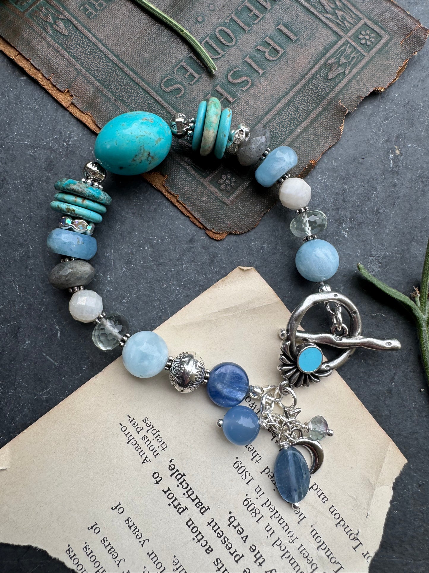 Turquoise stone, aquamarine, kyanite, green amethyst, labradorite, silver metal.