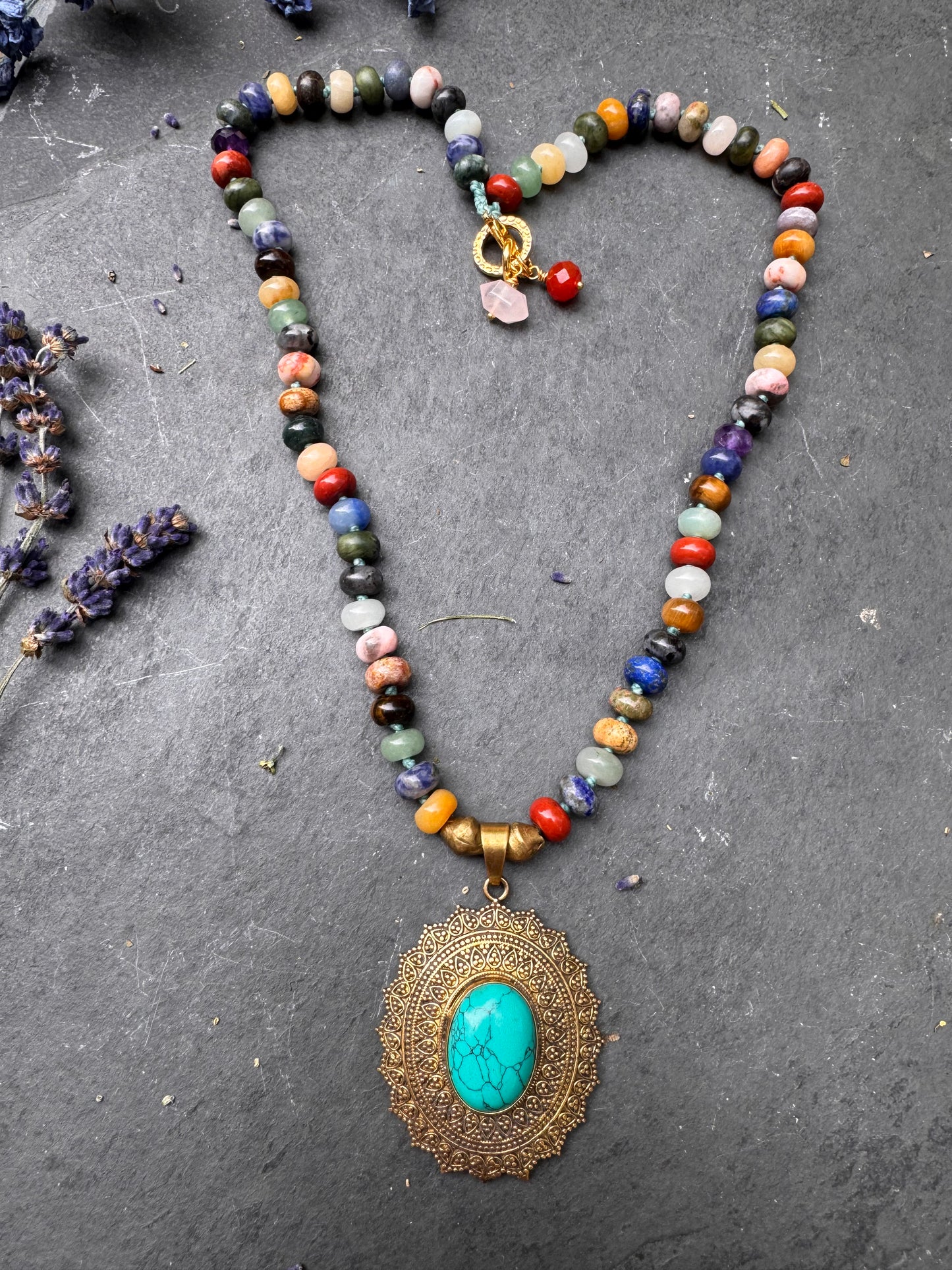 Mixed stone, knotted, brass metal and turquoise stone pendant, necklace