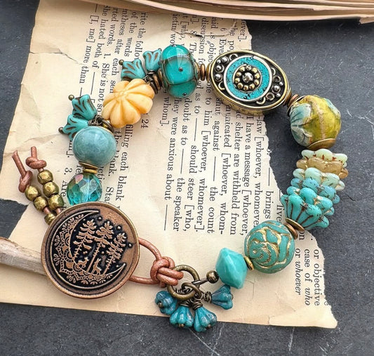 Teal. Nepal bead, ceramic beads, Mixed Czech glass flowers, lampwork glass, button clasp.