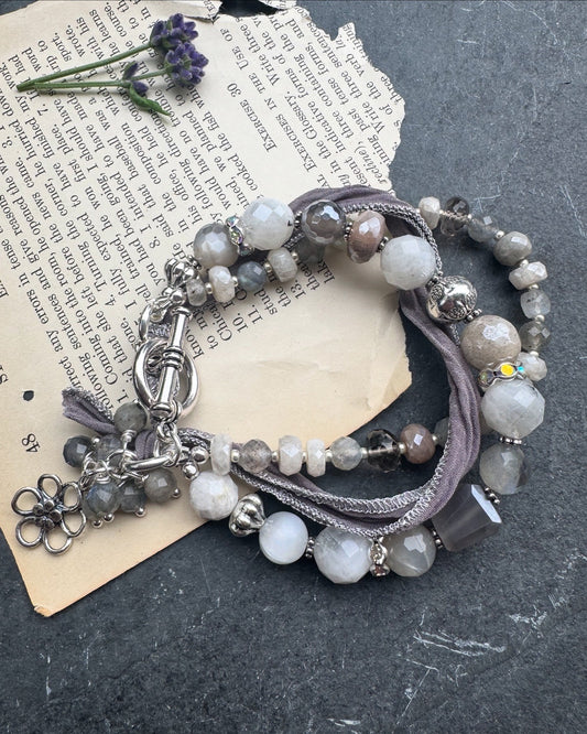 White & grey  moonstone, silver silk ribbon, and sterling silver metal.