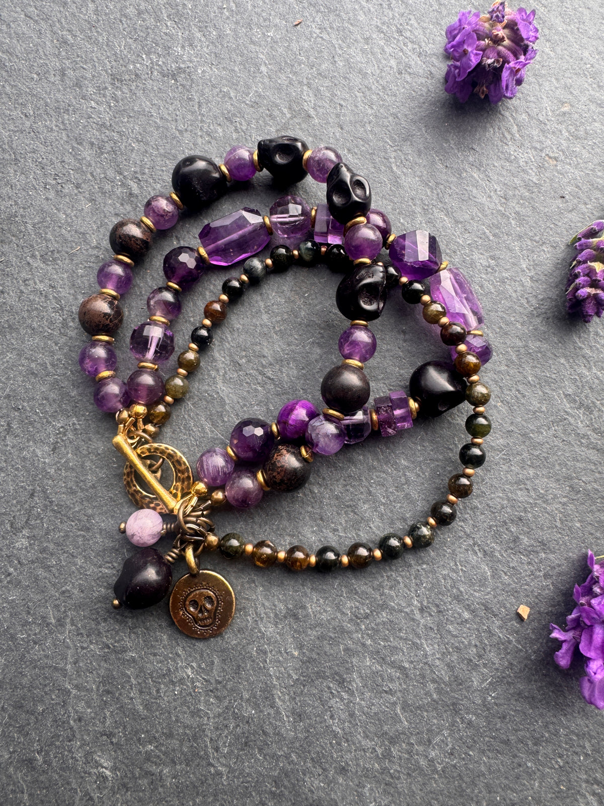 Amethyst stone, black skulls, black jasper, gold metal, Halloween, bracelet.