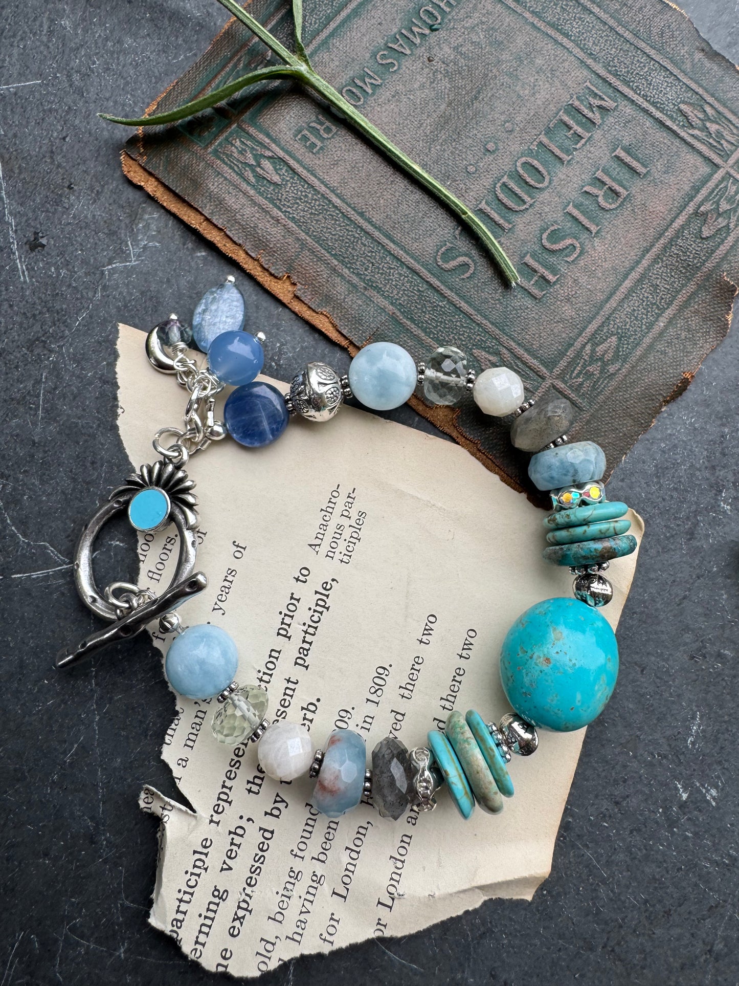 Turquoise stone, aquamarine, kyanite, green amethyst, labradorite, silver metal.