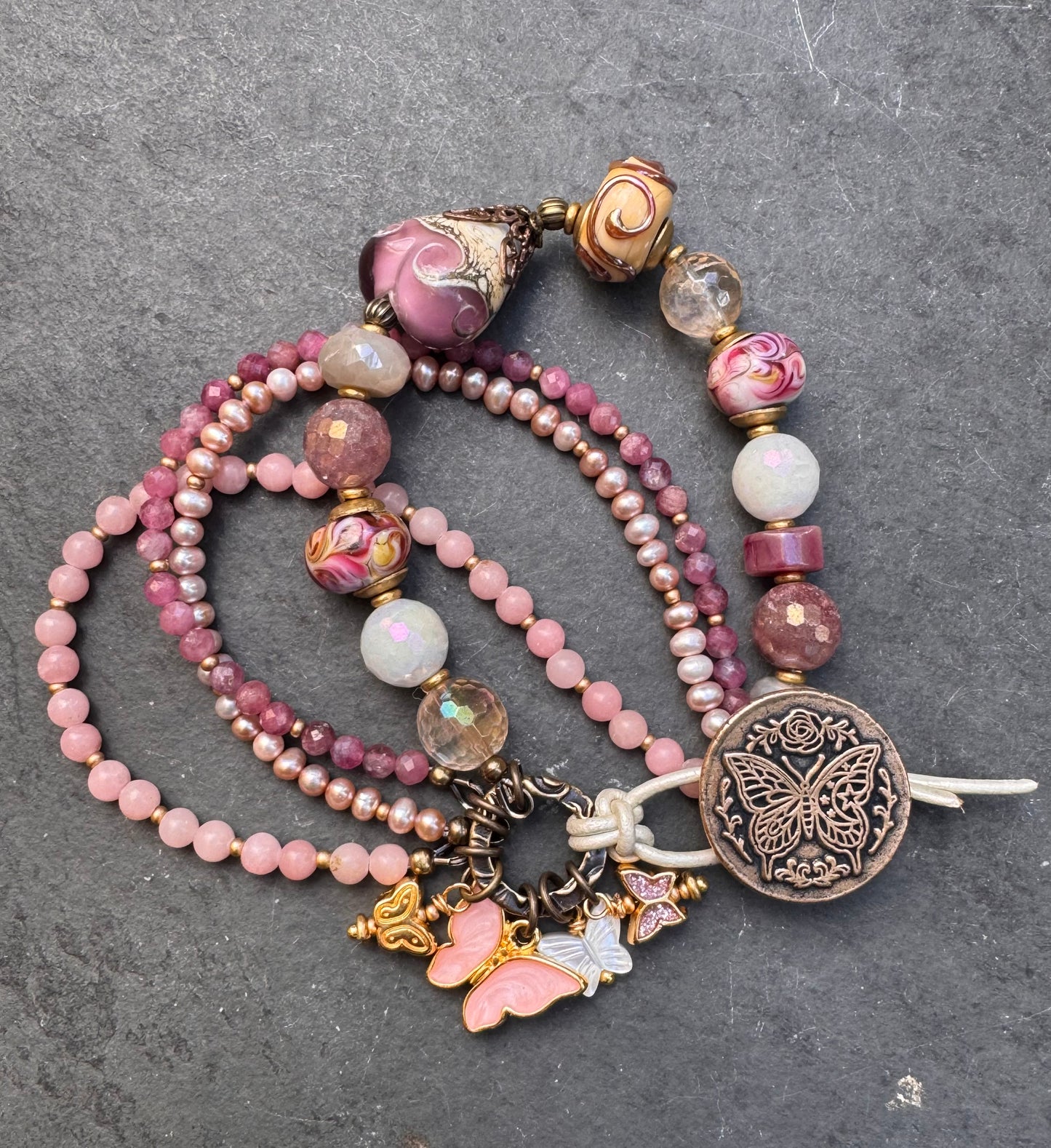 Pink opal, pink Tourmaline, moonstone mystic, strawberry quartz mystic, citrine mystic, pink pearls and handmade lamp work glass, bronze butterfly button, white leather.