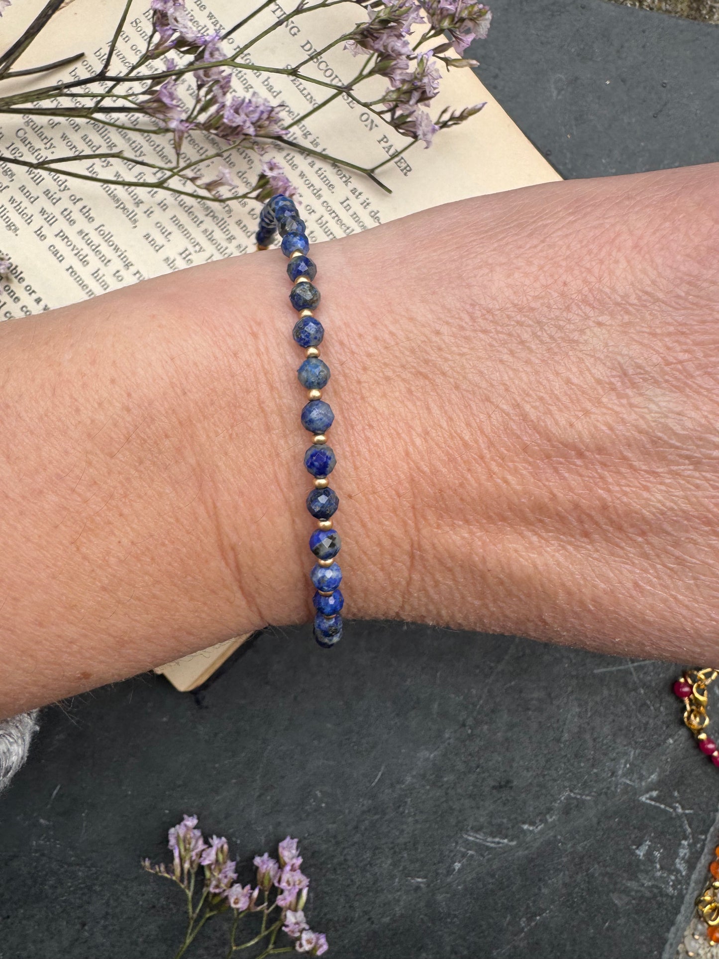 Lapis Lazuli round faceted stone, gold metal, bracelet