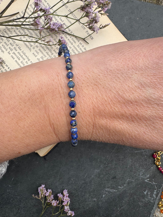 Lapis Lazuli round faceted stone, gold metal, bracelet
