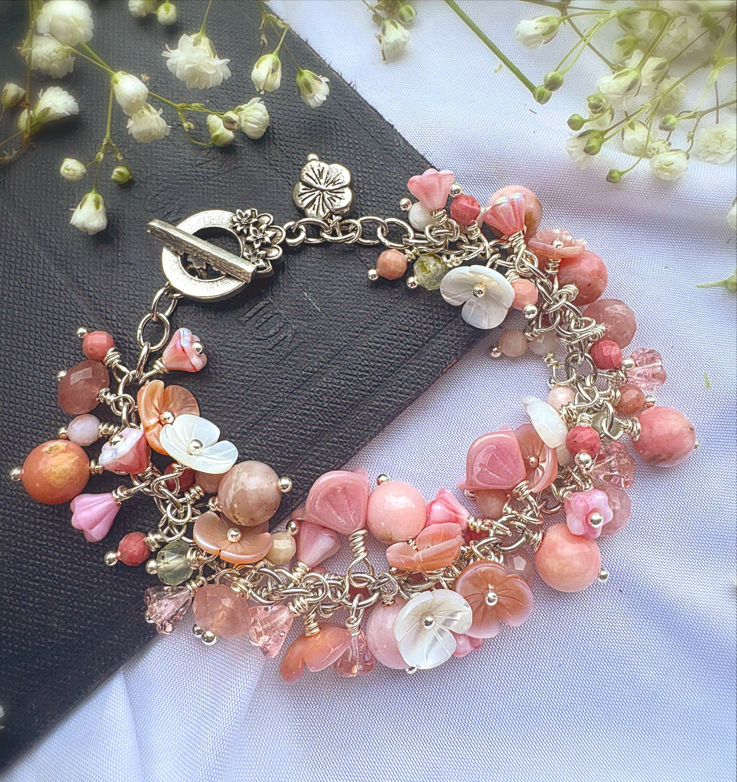 Pink opal, pink shell blossoms, rose quartz, peridot, sterling silver metal, blossom clasp, bracelet.