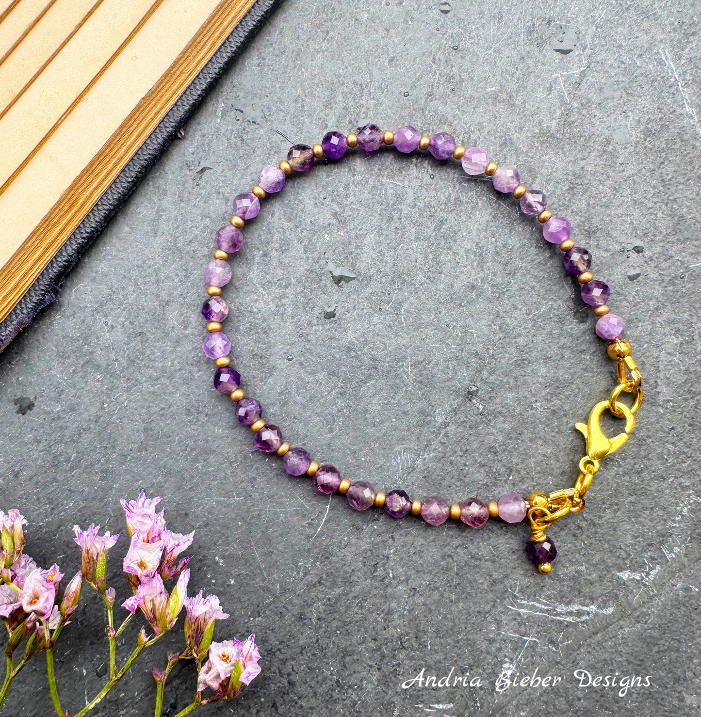 Amethyst (February birthstone)￼faceted stone, gold metal, bracelet