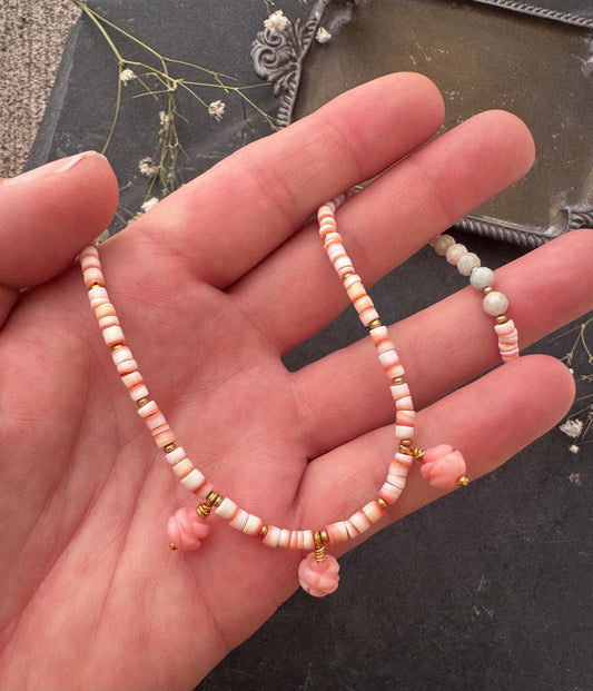 With conch shell rondelle heishi, pink opal carved stone flower beads and gold metal.