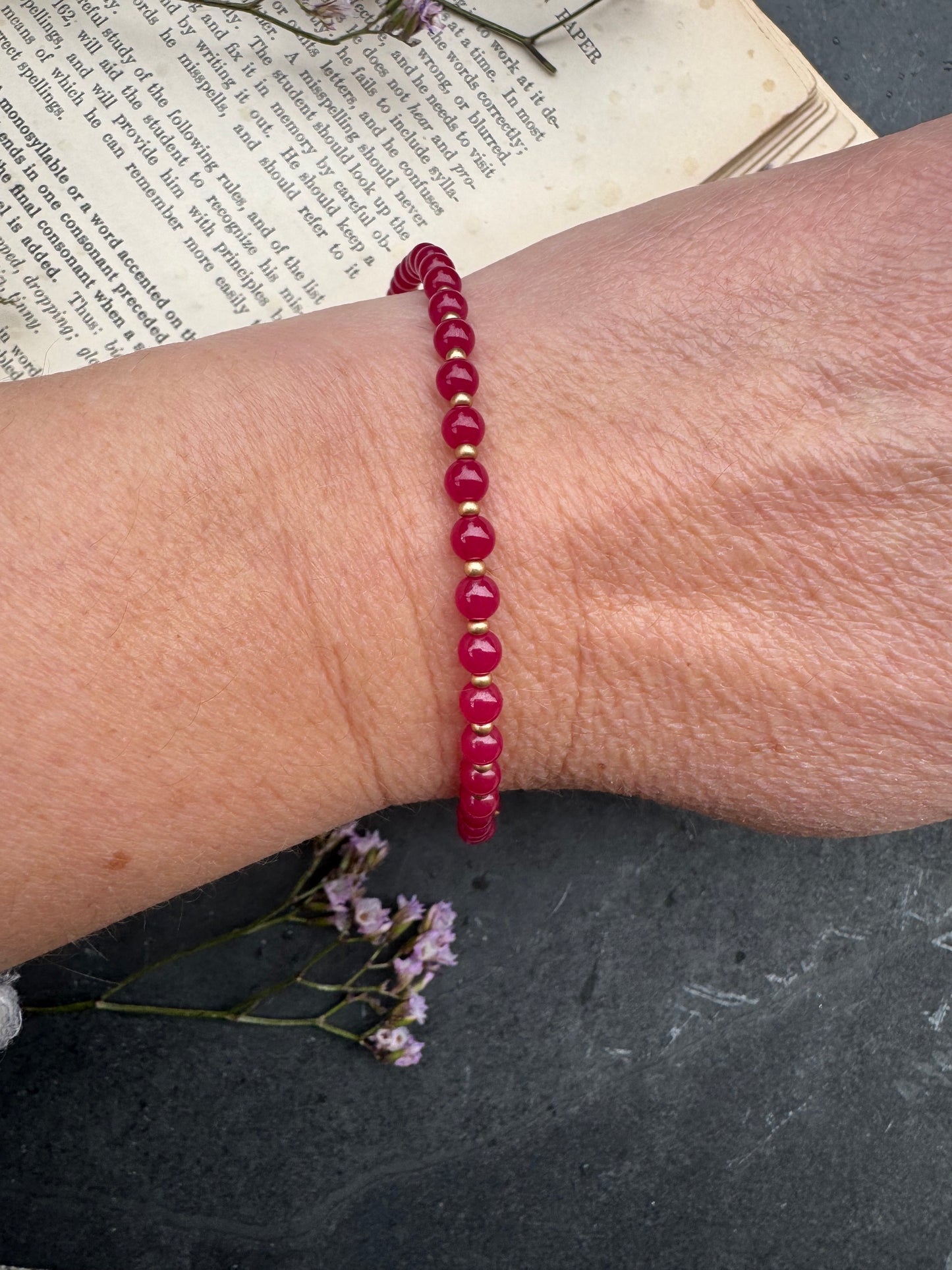 Ruby round stone, gold metal, bracelet