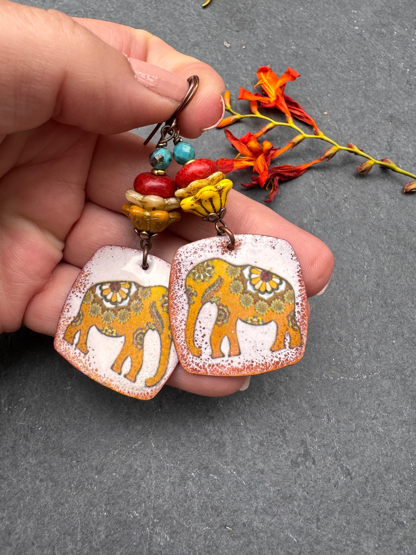 Elephant enameled metal charms, glass flower beads, red coral, turquoise and copper metal, earrings