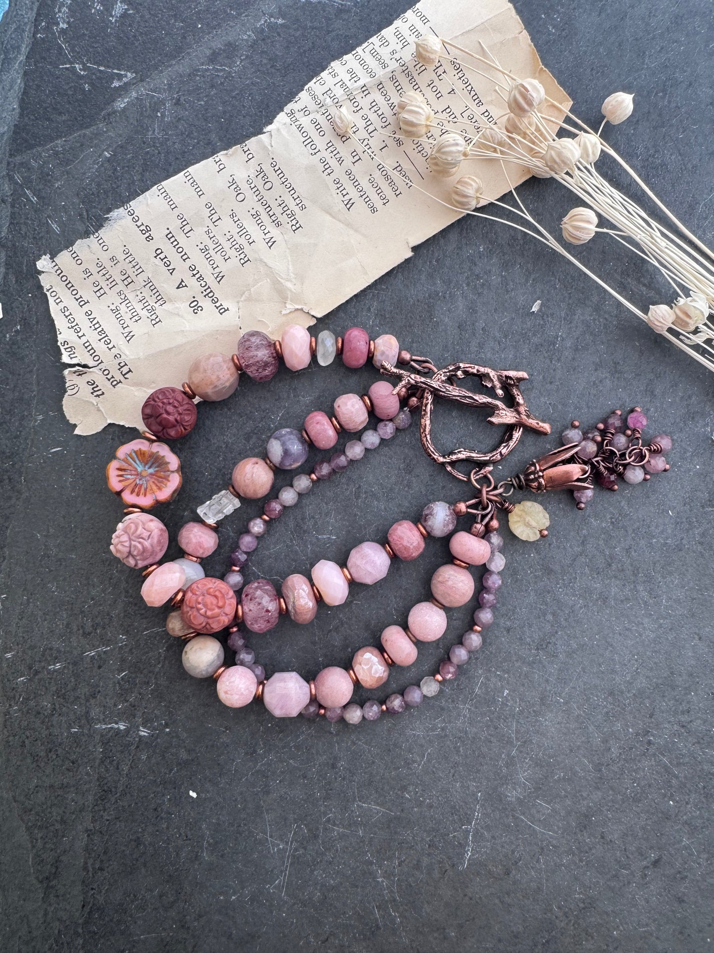 Mongolian agate carved flower, Ruby, Czech glass flower, rhodochrosite, strawberry quartz, moonstone, pink opal, purple mica, Lilac Lepidolite and copper clasp.