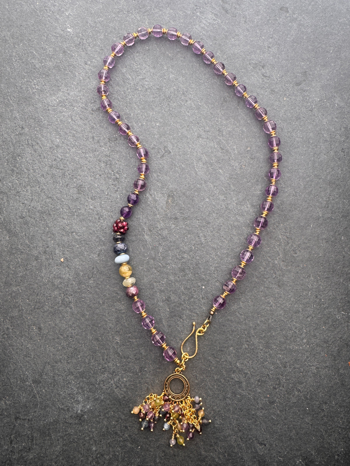 Amethyst faceted gemstone, iolite, green garnet, garnet, prehnite, peridot, aquamarine, blue opal and brass metal, necklace.