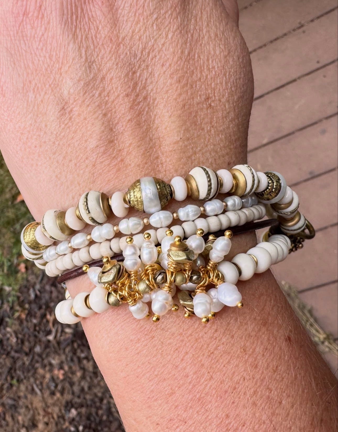 pearls, moonstone, java glass, leather, bone, African brass