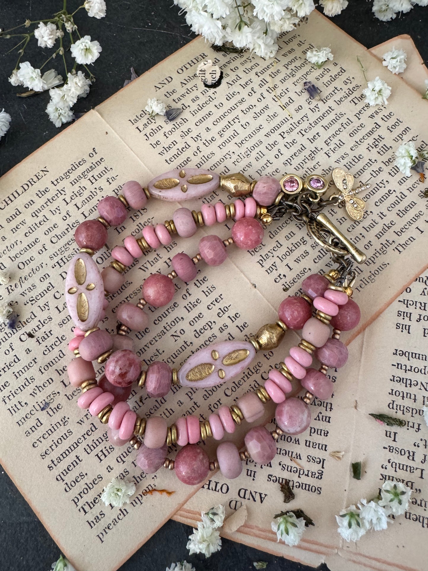 Pink Rhodonite, pink Indonesian glass, Czech glass, African brass, bracelet. Rhinestone, opal charms.