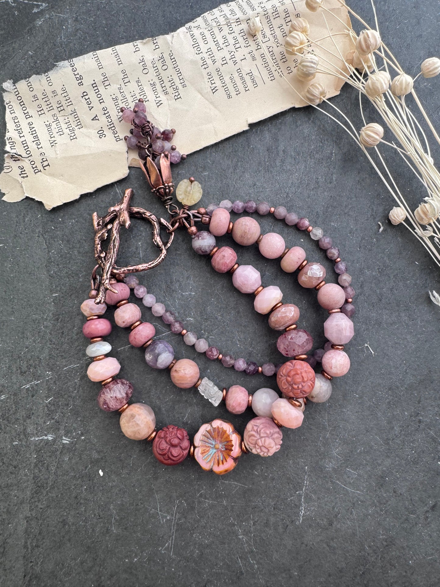 Mongolian agate carved flower, Ruby, Czech glass flower, rhodochrosite, strawberry quartz, moonstone, pink opal, purple mica, Lilac Lepidolite and copper clasp.