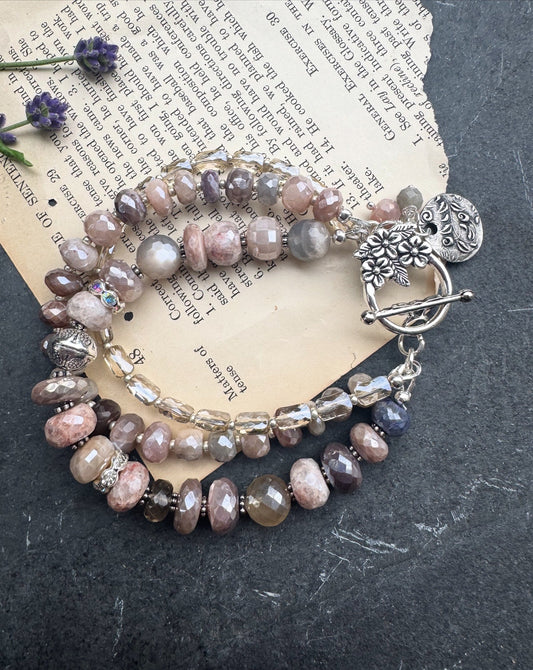 Peach & grey moonstone, crystal, and sterling silver metal.