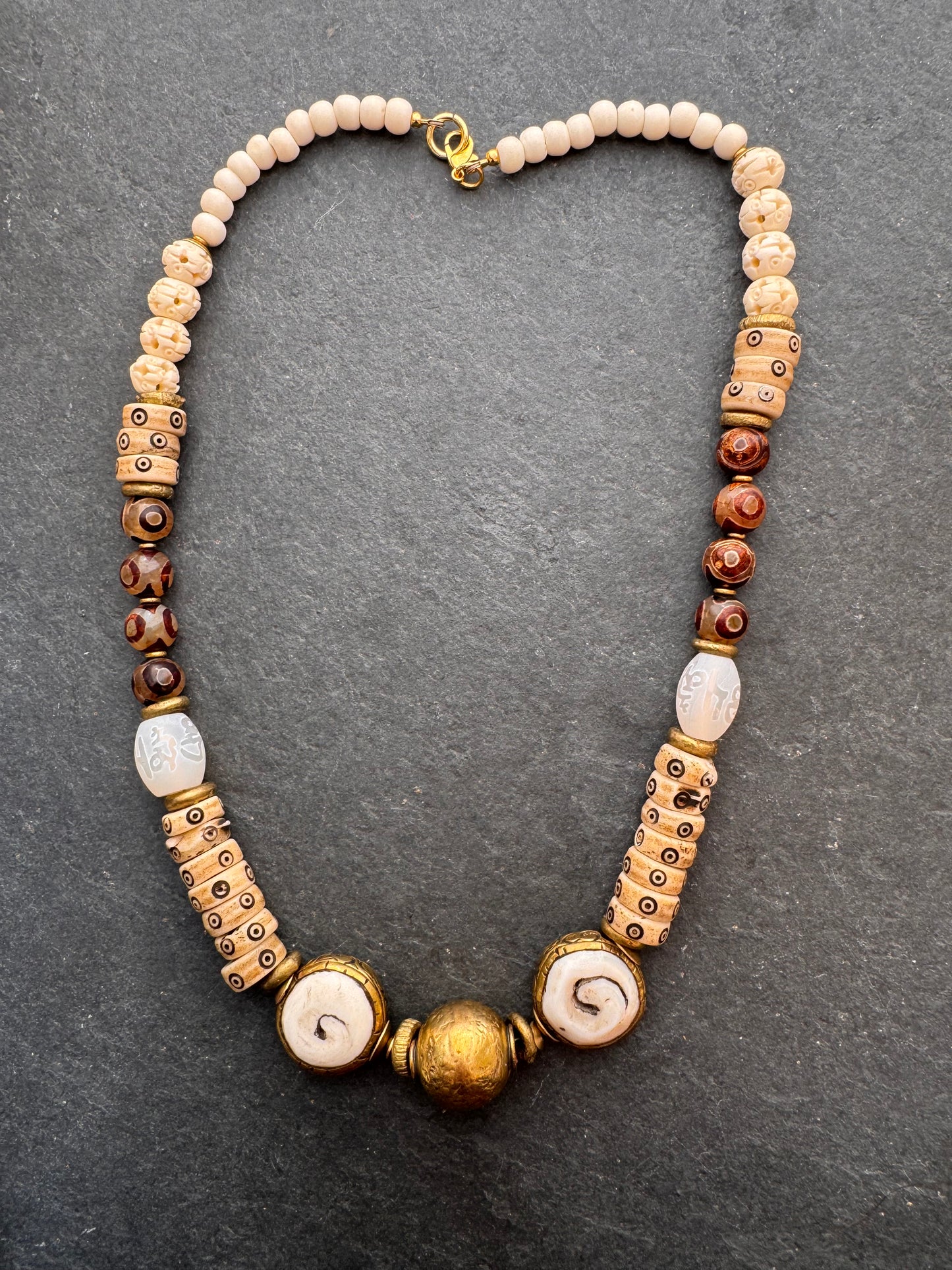 Java glass, African brass, dzi agate, bone, necklace