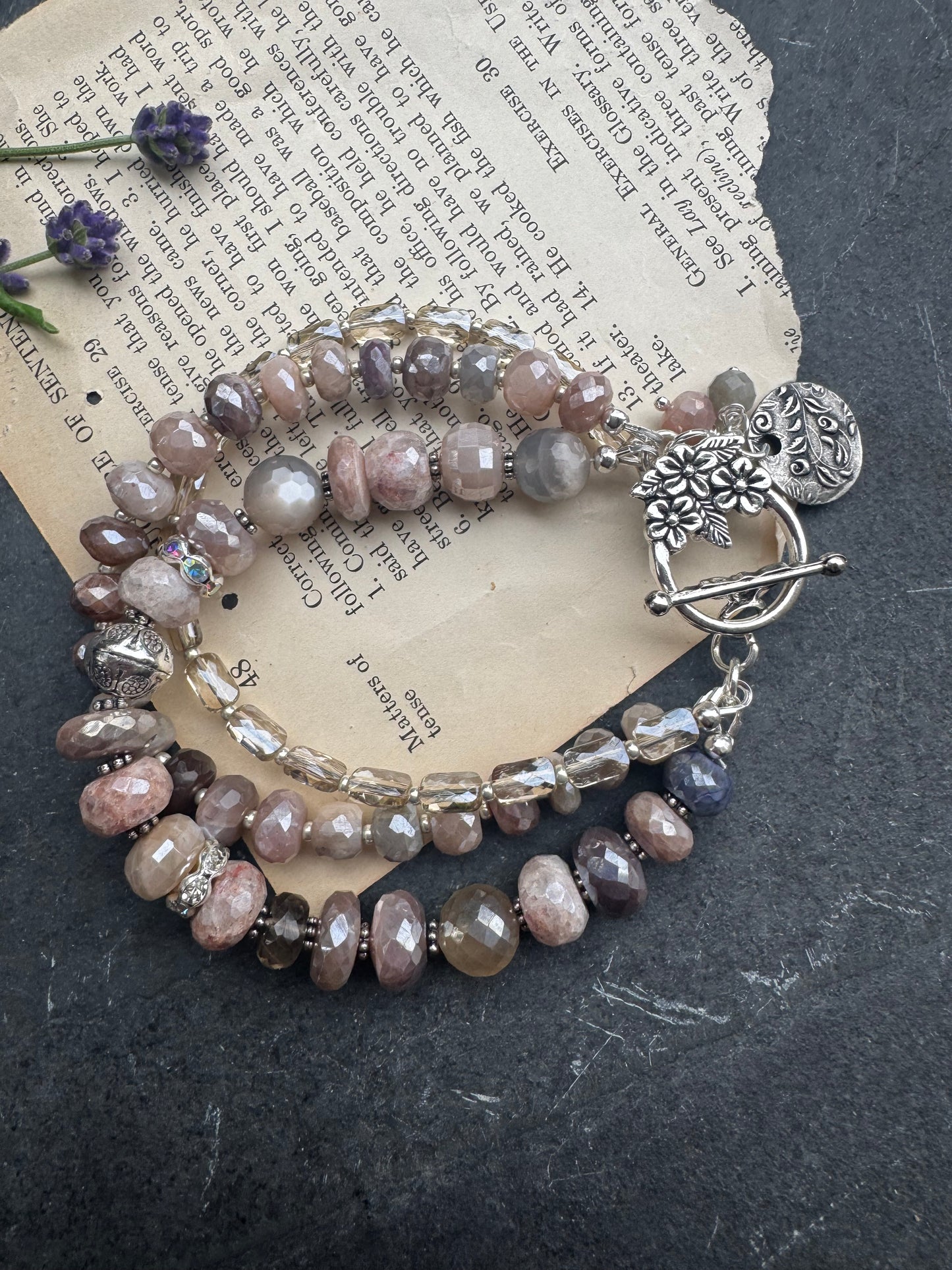 Peach & grey moonstone, crystal, and sterling silver metal.