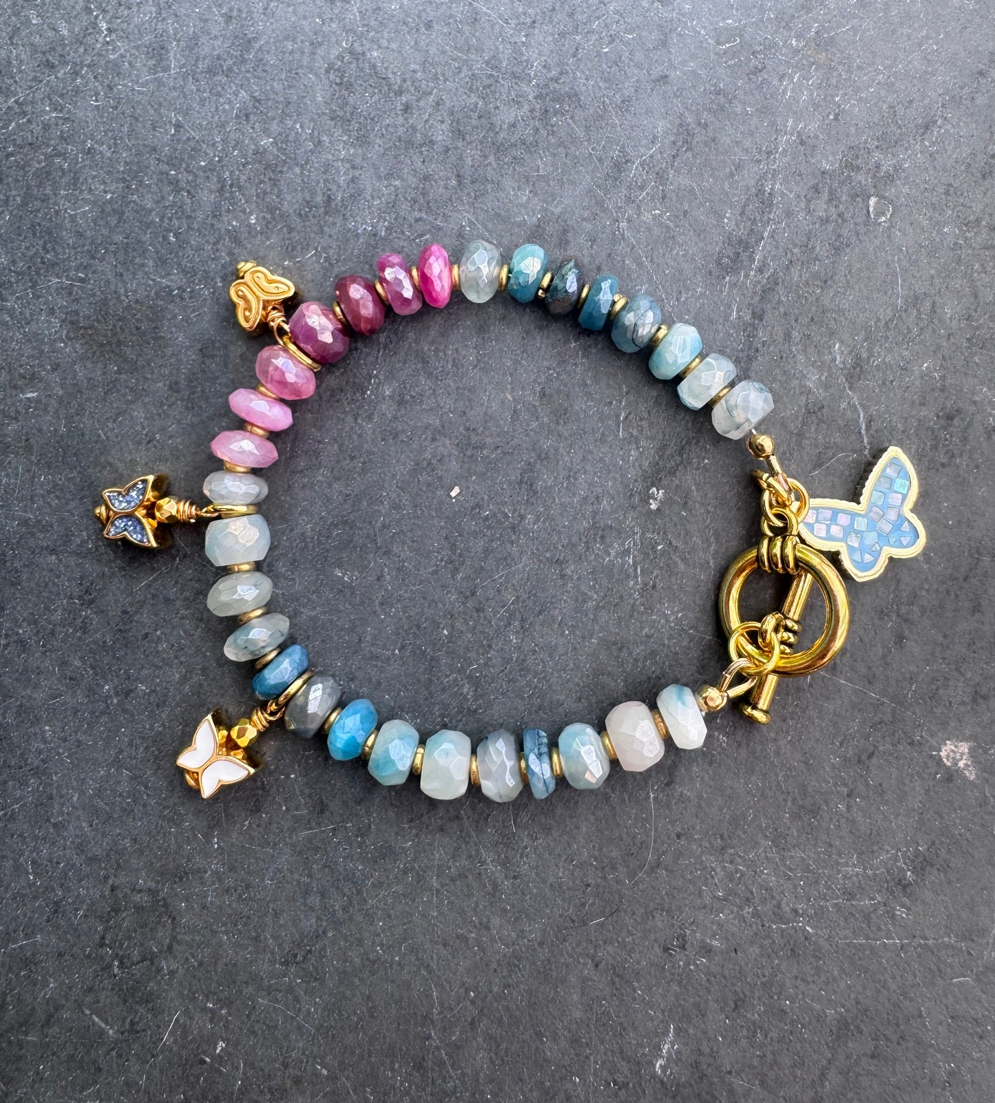Charm, blue and pink moonstone bracelet. gold metal bracelet.