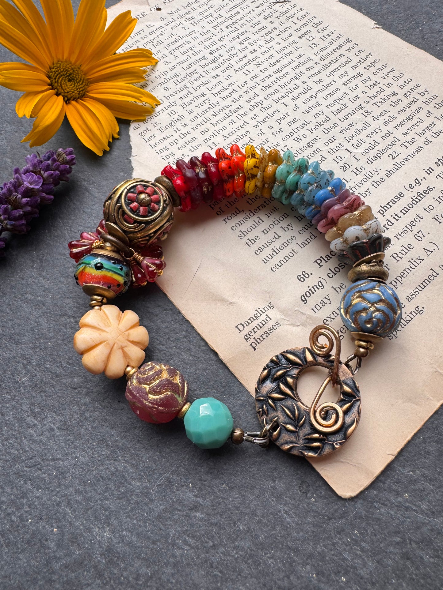Rainbow flowers. Nepal coral flower bead, Mixed Czech glass flowers, lampwork glass, leaf bronze toggle clasp.