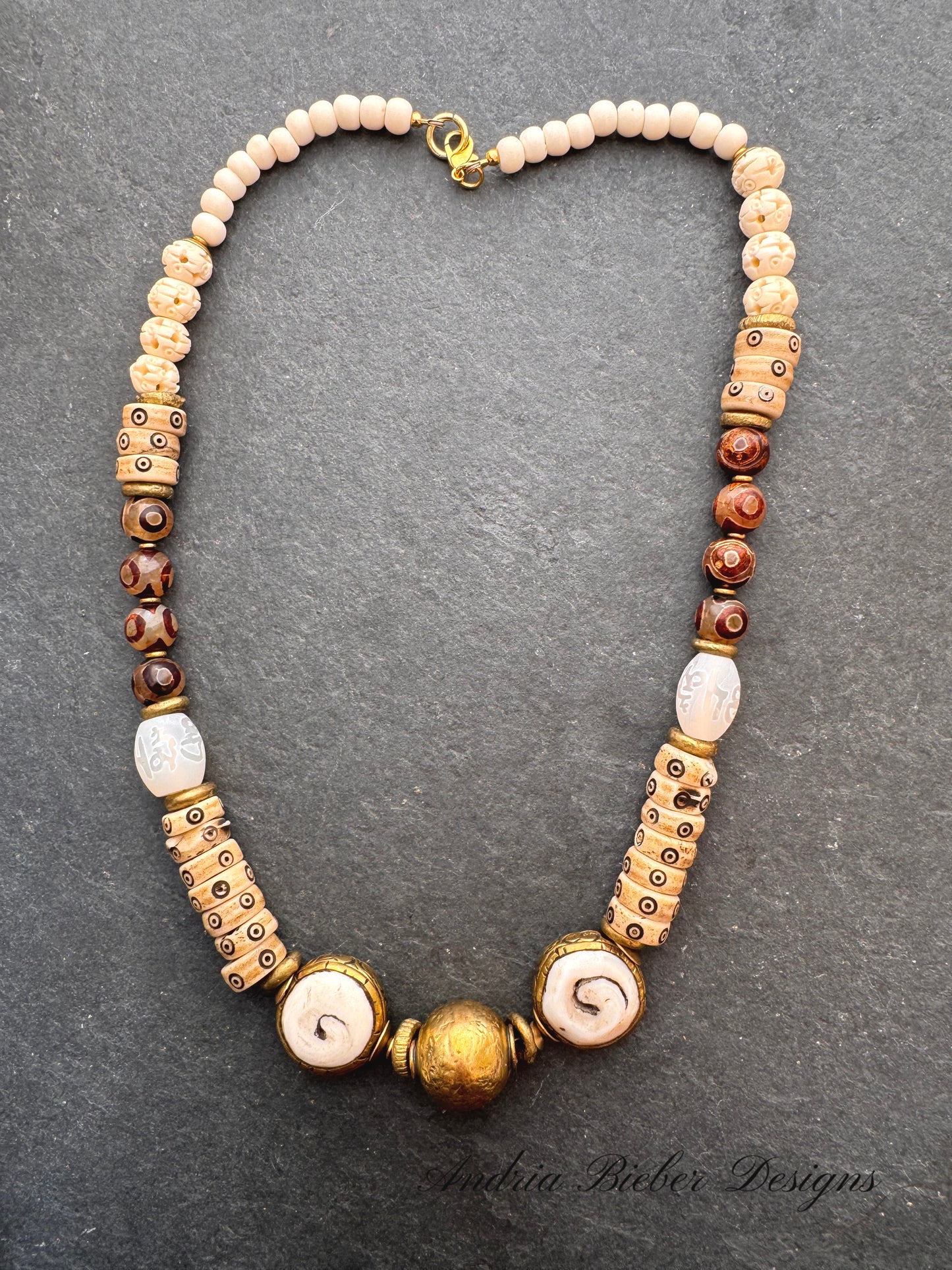 Java glass, African brass, dzi agate, bone, necklace