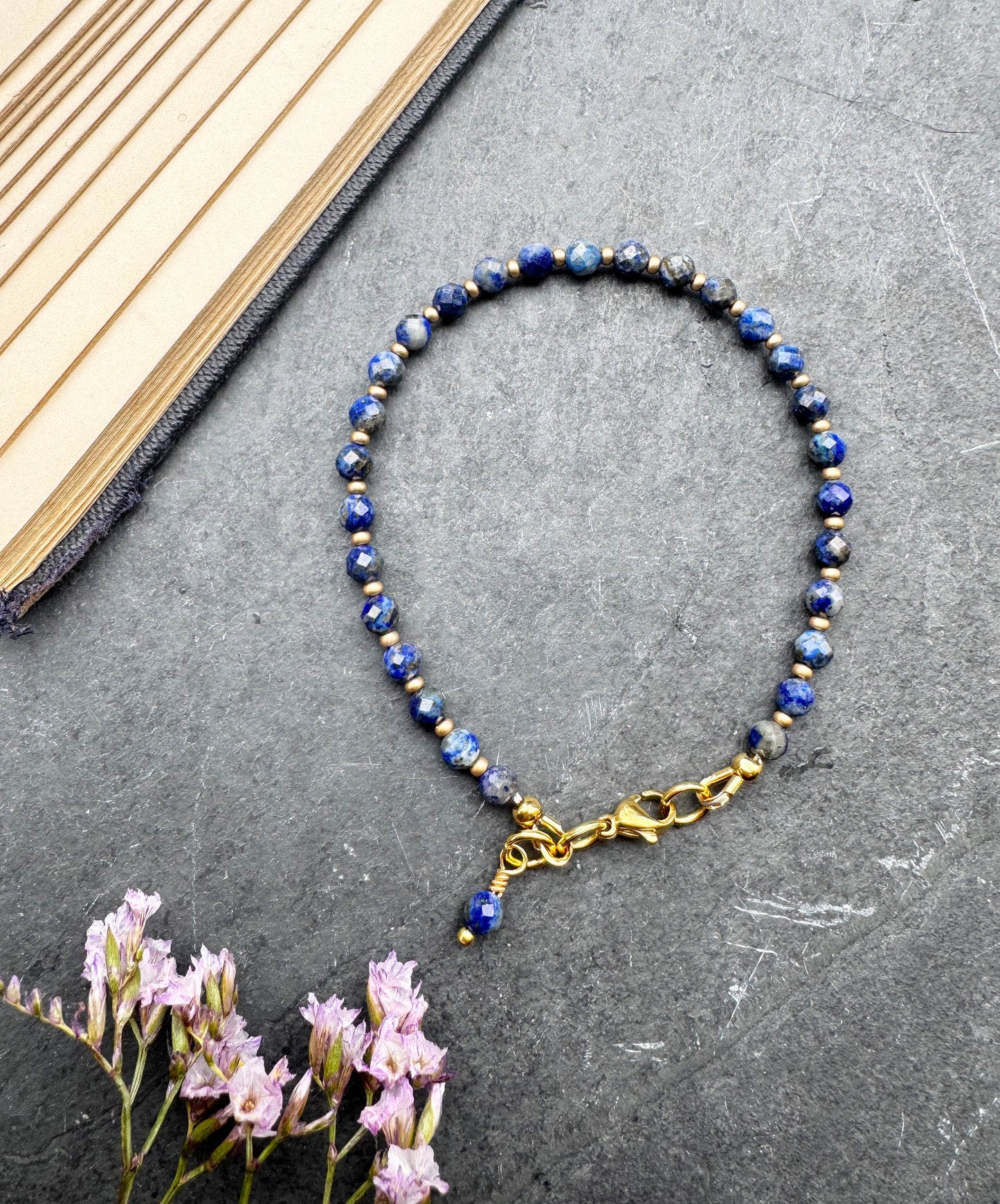 Lapis Lazuli round faceted stone, gold metal, bracelet