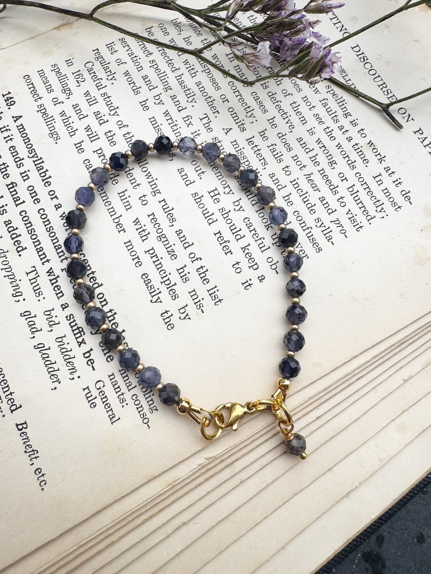Iolite faceted stone, gold metal, bracelet