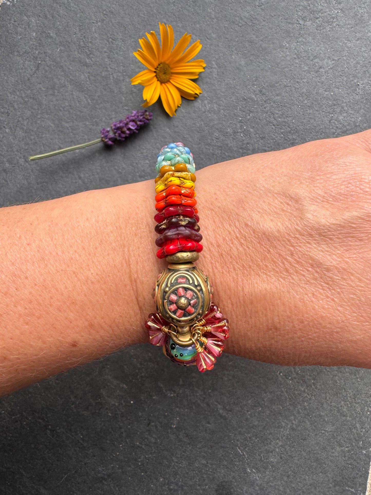 Rainbow flowers. Nepal coral flower bead, Mixed Czech glass flowers, lampwork glass, leaf bronze toggle clasp.